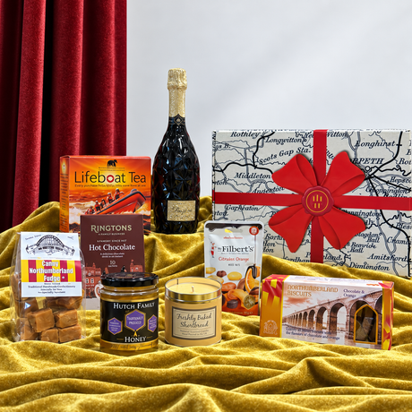 “Northumbrian Best Wishes hamper with Prosecco, tea, hot chocolate, honey, fudge, biscuits, nuts, candle and gift box.”