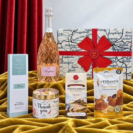 Northumbrian Thank You hamper with rosé Prosecco, milk chocolate, chocolate and nut mix, candle, reed diffuser and gift box.