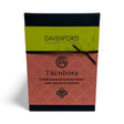Davenports box of 12 Tácnbora dark chocolate whisky truffles with green and copper-coloured packaging and a dark ribbon.
