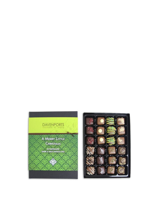A collection of Davenports Chocolates A Merry Little Christmas Truffles, featuring a variety of chocolate pieces with packaging and a green and black box with the brand and product name.